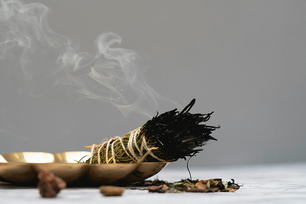 The Power of Smudging: A Guide to Clearing Negative Energy from Your Home smuding image